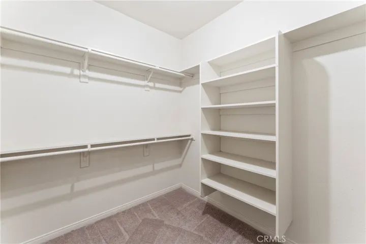 Primary Walk-In Closet (Size:8'4" x 7'0")