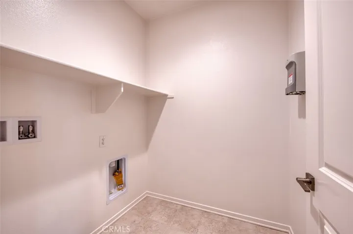 Convenient upstairs laundry room with washer and gas dryer hook-ups.