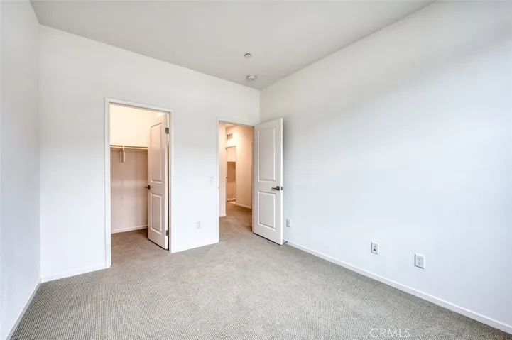 Second bedroom with walk-in closet.