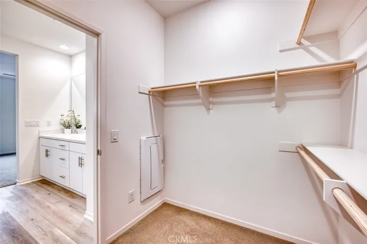 Primary en suite bathroom and walk-in closet.