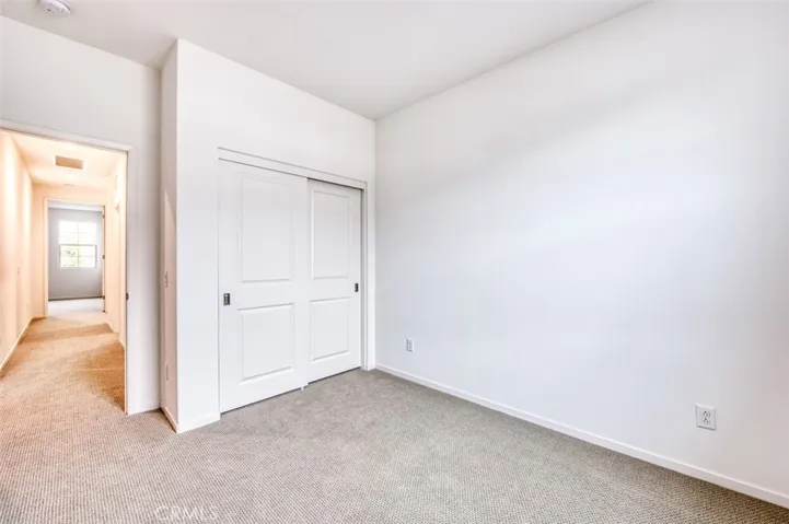 Third bedroom with generous closet space.
