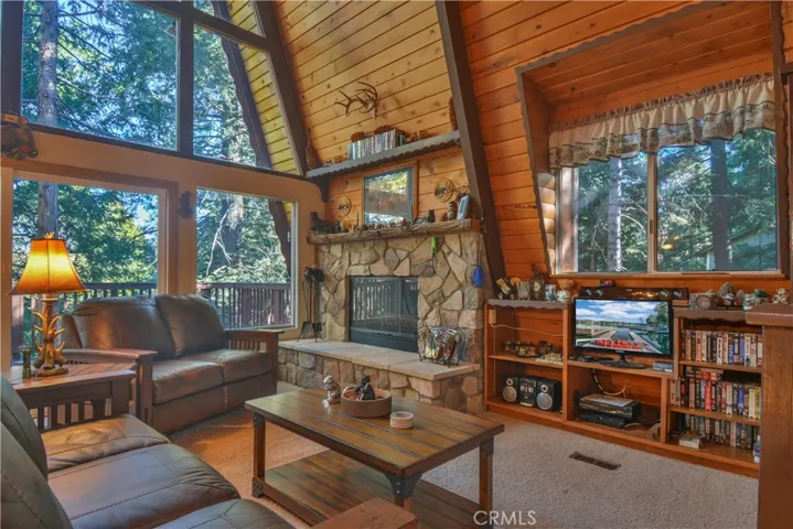 Fully Furnished Living Room with Tree Views from every Window