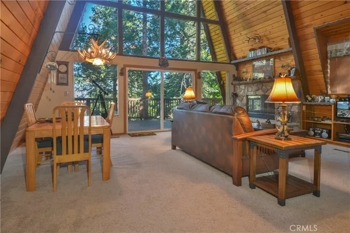 Dinning & Living Room with Stone Fireplace