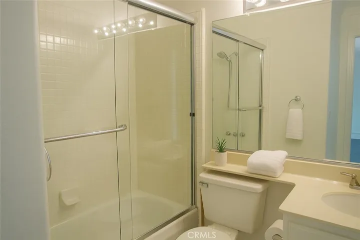 Upstairs full bath in 2nd Bedroom. Virtually Staged