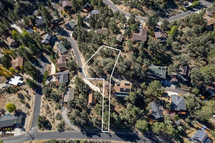 Lot lines are approximate. Boundaries are determined by land surveyors. This flag lot has a strip originally intended to provide access from Oakwood, however vehicular access is now from Tyndall.