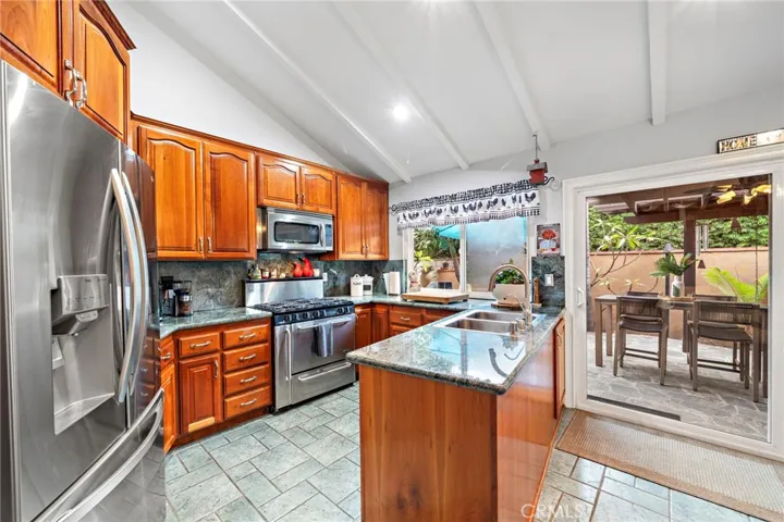 Chef’s kitchen is a true highlight, showcasing solid cherry cabinetry