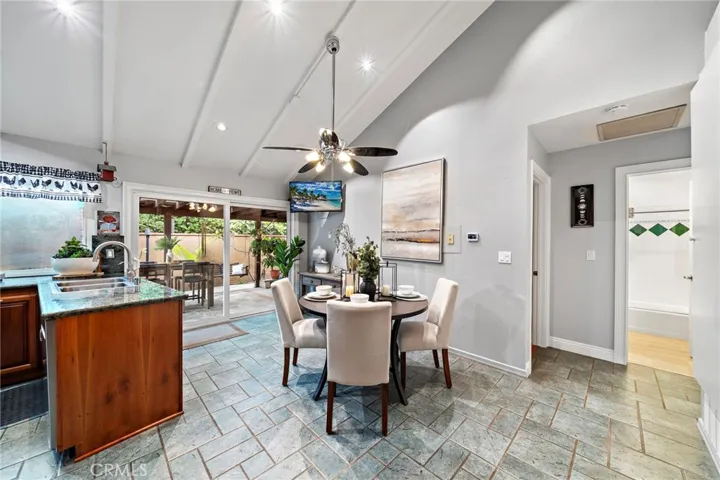 Dining/kitchen open concept with soaring ceilings
