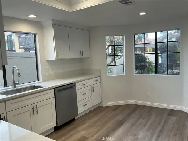 Kitchen looking towards front, gated entry