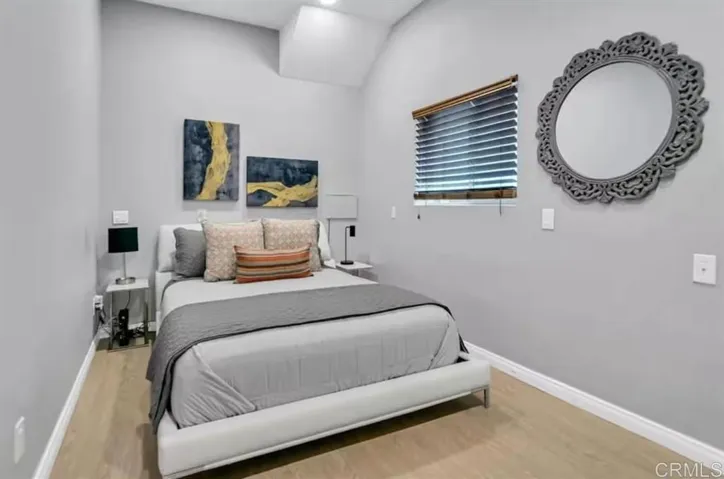 Queen bed, with storage underneath.  Small closet in room with TV and dresser.  On ground floor.