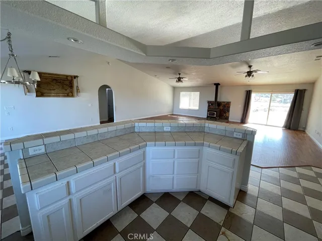 Main house view of kitchen island and expansive open concept family room