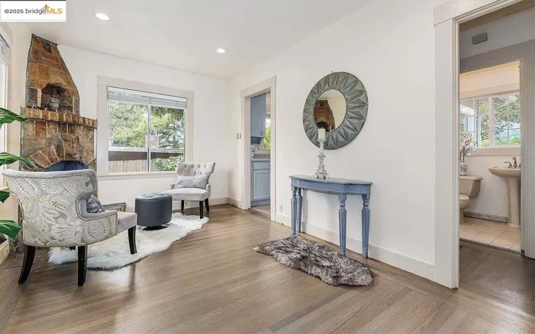 Living area featuring wood finished floors and recessed lighting