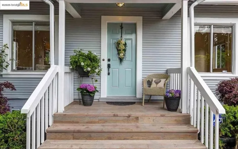 Entrance to property featuring covered porch