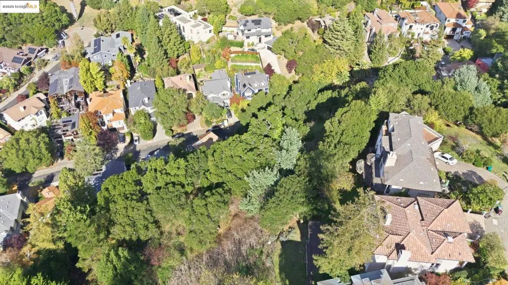 Aerial view of property's location with nearby suburban area
