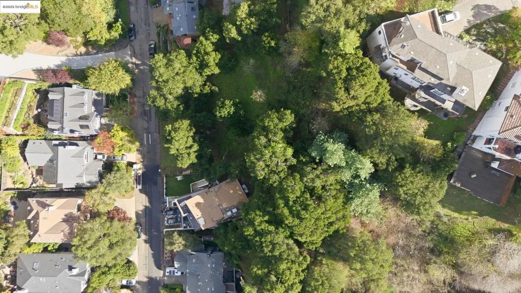 Aerial view of property's location with nearby suburban area