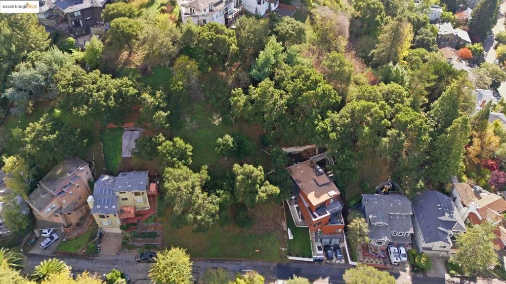 Aerial view of property's location featuring nearby suburban area