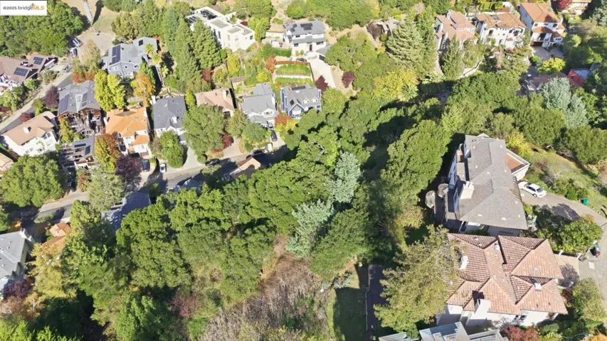 Aerial view of property's location with nearby suburban area