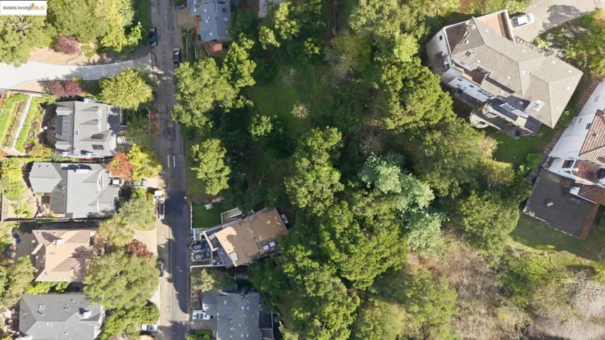 Aerial view of property's location with nearby suburban area