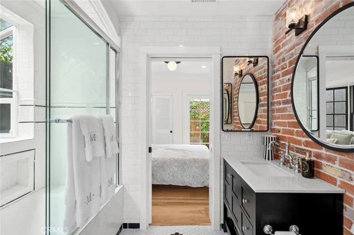 Two bedrooms on the main level, connected by a Jack & Jill bathroom, provide effortless single-level living.