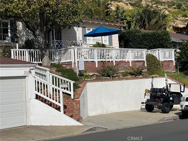 Park a small car or golf cart in the spot below the house, It's your spot.