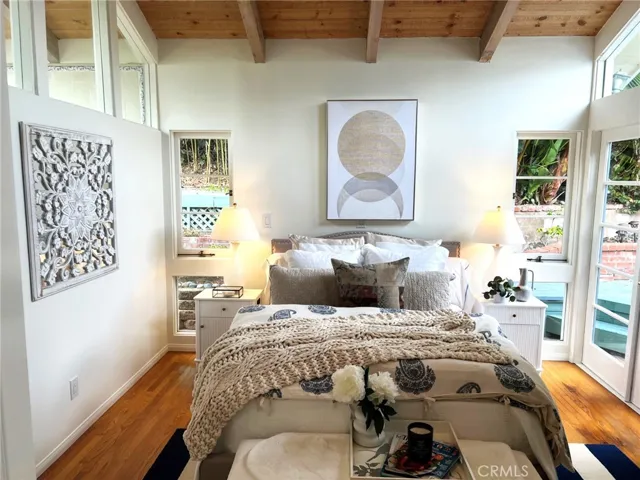 Primary bedroom with high ceilings.