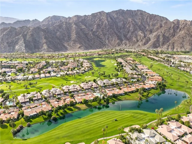 Aerial view above condo with view of fairway and Santa Rosa Mountains
