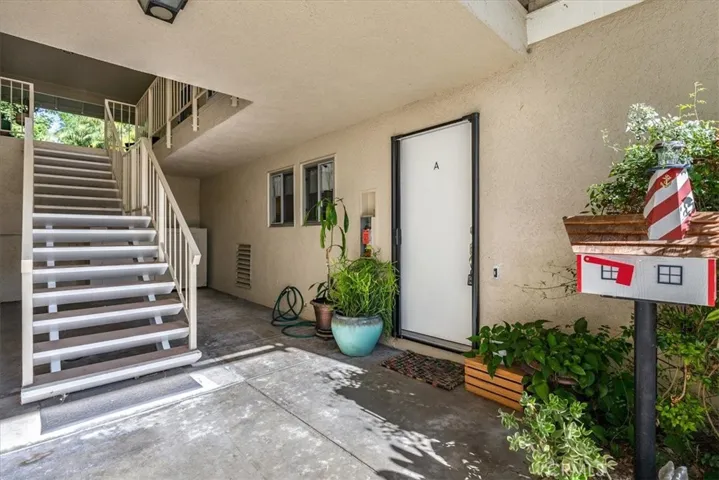 Stair up to carport or park on street a few feet away