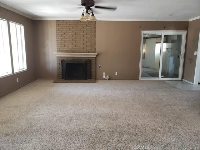 Living Room. Sliding glass door leads to utility room and garage