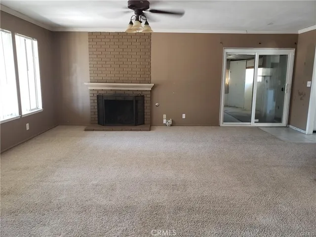 Living Room. Sliding glass door leads to utility room and garage