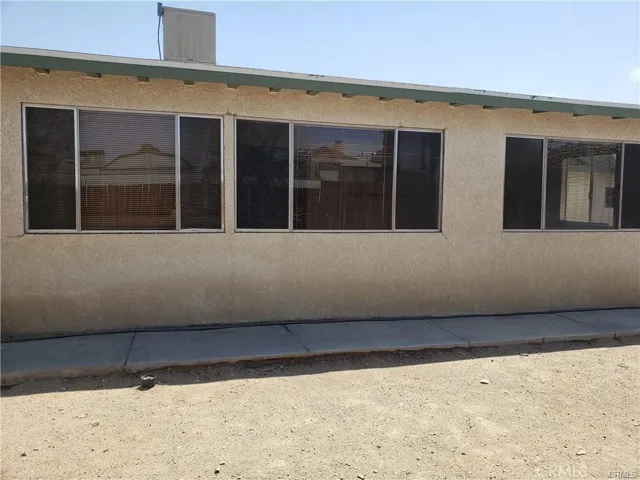Back yard view of windows of family/bonus room