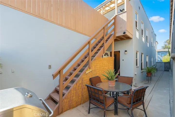 Patio for Downstairs Unit and Stairs to Deck