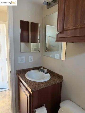 Bathroom featuring vanity and toilet