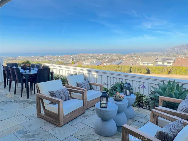 Patio with ocean, city and mountain views