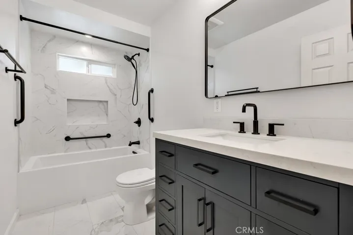 Remodeled Main Bathroom (2024)
Modern solid wood vanity with quartz counter top
Undermount basin
Matte black hardware & faucets
Dressing mirror & medicine cabinet
Designer lighting
Porcelain tile shower/tub walls
Kohler® soaking tub
Toto® commode
Panasonic® Whisper exhaust fan
Complementary porcelain tile floors