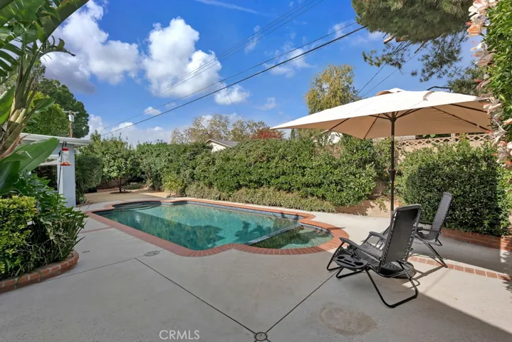 Entertainer’s Back Yard
Private paradise
Sparkling in-ground pool & spa
Resurfaced (2019)
Mini pebble-bottom
New heating and filter equipment (2019)
LED color changing lights 
Newer brick coping and tile
Covered patio
BBQ area on side yard
Mature fruit trees (lemon, orange, nectarine & pomegranate)
Bubblers and drip system on timer
Block wall fencing