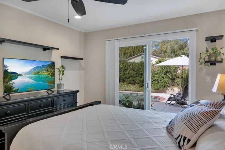 Primary Bedroom
Smooth ceilings
Crown molding
Ceiling fan
LED recessed lights
Closet with organizers
Sliding glass door leading to the backyard
Rich hardwood floors