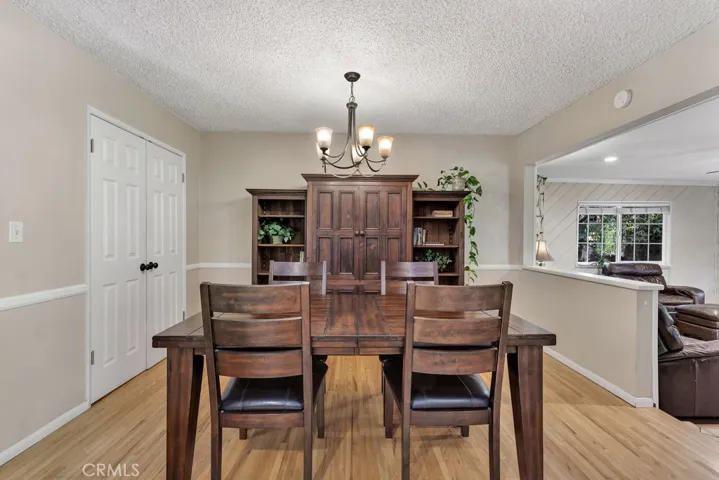 Dining room
Drop down lighting
Large double door closet offering additional storage Chair railing
Rich hardwood floors