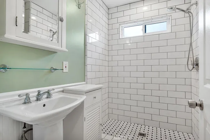 Remodeled Second Bathroom (2017)
Pedestal sink
Tempered glass shelf
Chrome fixtures
Chic dressing mirror/medicine cabinet
Built-in linen storage
Designer lighting
Subway tiled step-in shower
Toto® commode
Panasonic® Whisper exhaust fan
Custom black & white dot basket weave tiled floors and shower floor