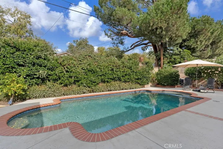 Entertainer’s Back Yard
Private paradise
Sparkling in-ground pool & spa
Resurfaced (2019)
Mini pebble-bottom
New heating and filter equipment (2019)
LED color changing lights 
Newer brick coping and tile
Covered patio
BBQ area on side yard
Mature fruit trees (lemon, orange, nectarine & pomegranate)
Bubblers and drip system on timer
Block wall fencing