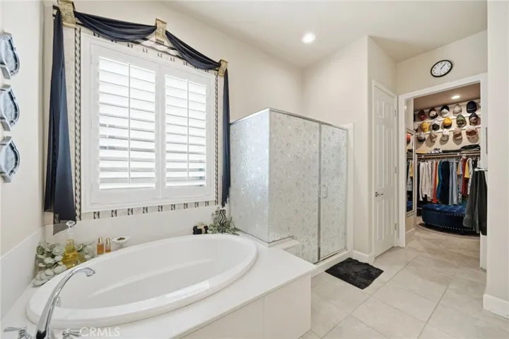 Primary Bathroom: Large Roman Soaking Tub and Private Oversized Walk-In Shower