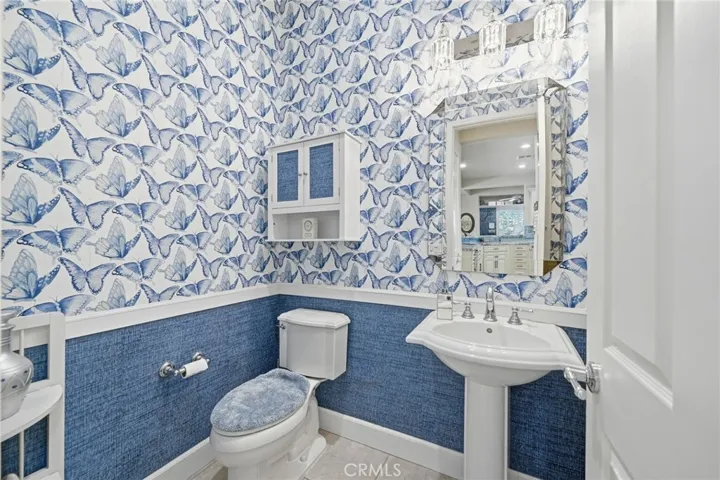 Half-Bath (Powder Room) Located Near Kitchen and Laundry