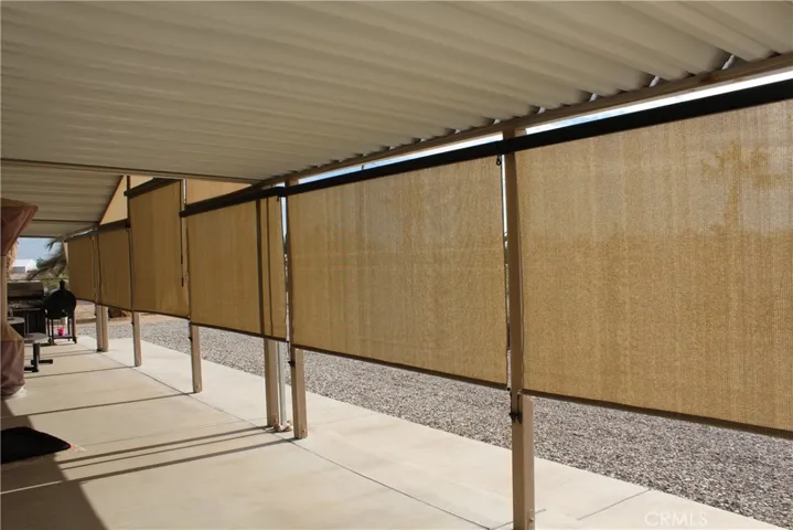  Six pull down sunshades installed on front porch, color changing lights above shades