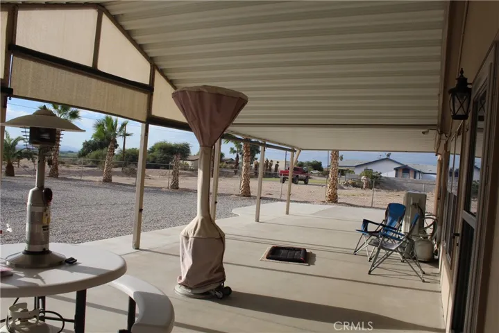 Patio heater and dining area on front porch