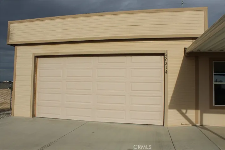 Flat roof garage attached to home