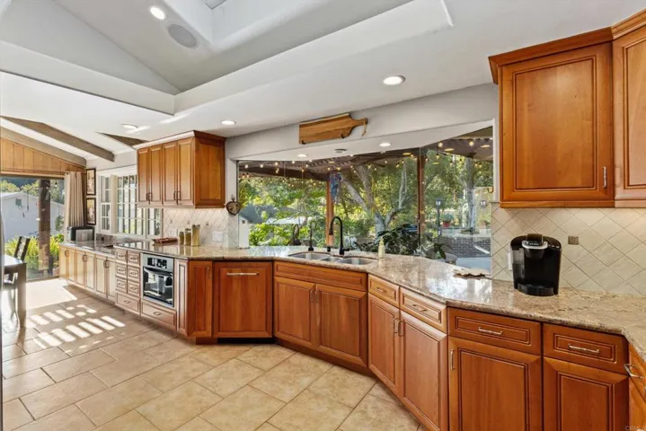 Chef's Delight - Custom Cabinets with under-lighting, pull-out shelves, soft-close doors/drawers