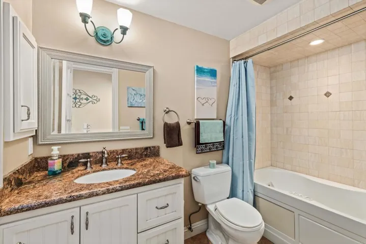 This full bath services the pool. Door to back patio just outside this bathroom. Jetted Tub