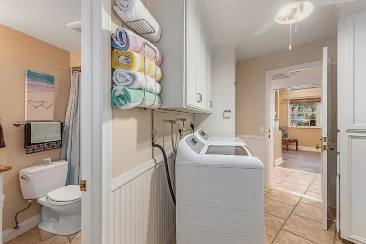 Full Closet across from washer/dryer for storing vacuums, mops, cushions for patio furniture, etc.