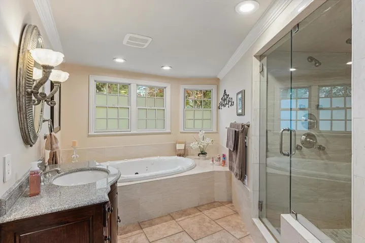 Spa-like w/Jetted Soaking Tub and a Shower built for Two with 12 shower heads including a rain head
