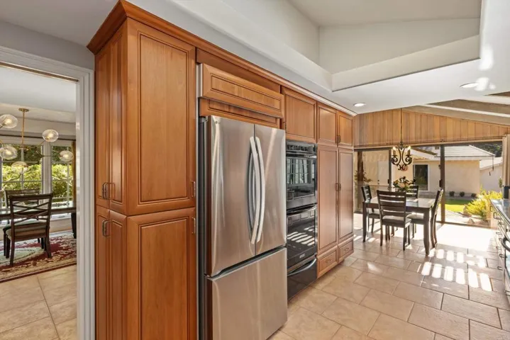 New Refrigerator stays w/house.  Warming drawer under double ovens.