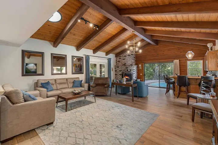 Formal Living Room w/Open Beam Ceilings and Bar with New Wine Refrigerator.