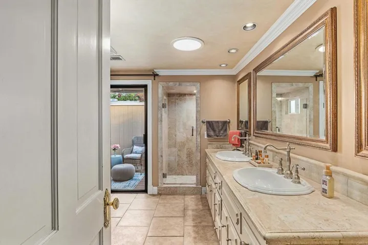 Travertine Counter w/Dual Sinks / Upscale faucet fixtures / Tile Shower w/frameless glass door